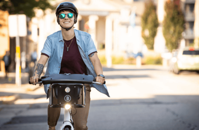 person riding bicycle on street in boulder colorado
