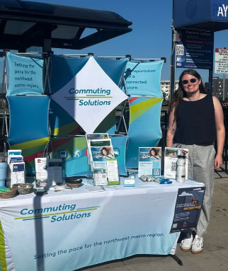Commuting Solutions boot with woman standing beside it at an RTD Rider Appreciation event